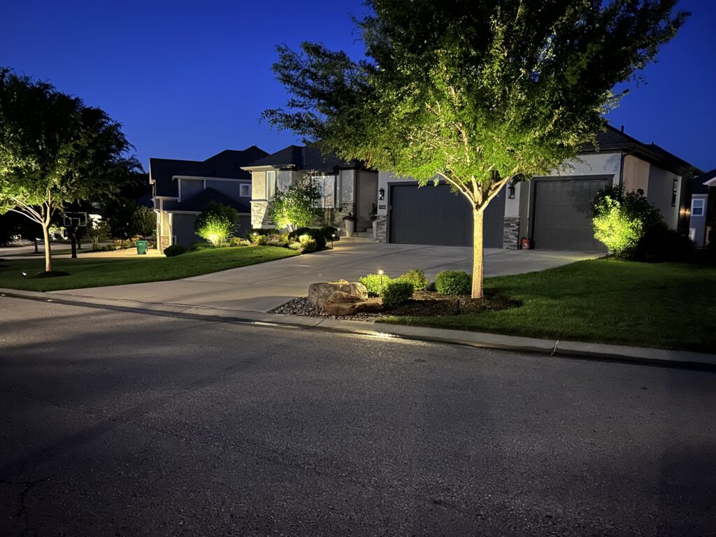 house at night with landscape lighting