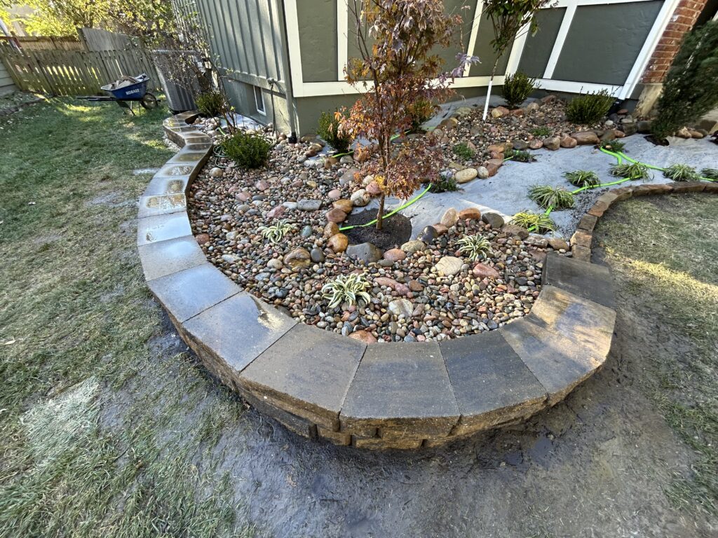 Retaining wall with garden bed, fall foliage