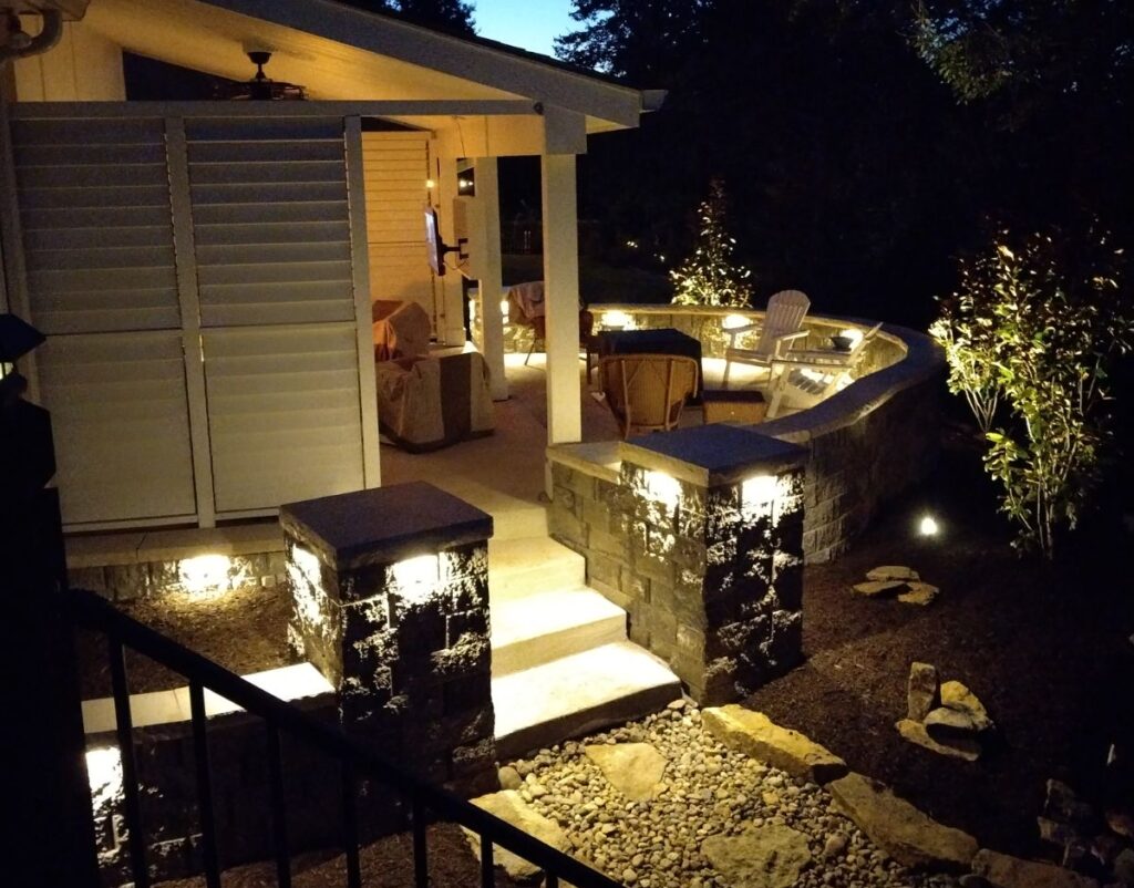 Stone retaining wall with built-in lighting.