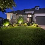 House with detailed landscaping out front6 with custom landscape lighting for better curb appeal