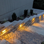 Stone staircase and retaining wall with built-in landscape lighting, hardscaping project